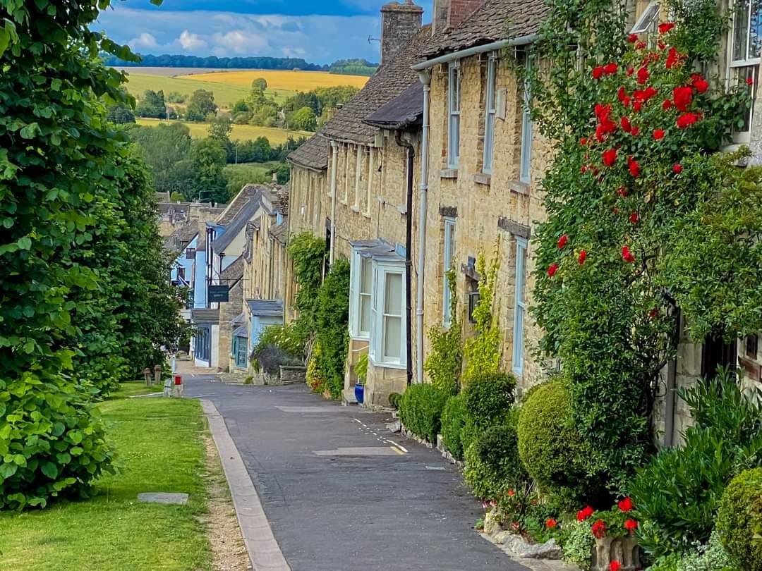 <p>High Street Burford is a historic and scenic street in Burford, a town in the Cotswolds region of England. It is famous for its medieval bridge over the River Windrush, its impressive church, and its ancient houses and shops. </p><p><br></p><p>It is also a popular destination for tourists, who can enjoy the views, the museums, the restaurants, and the antique shops.</p>