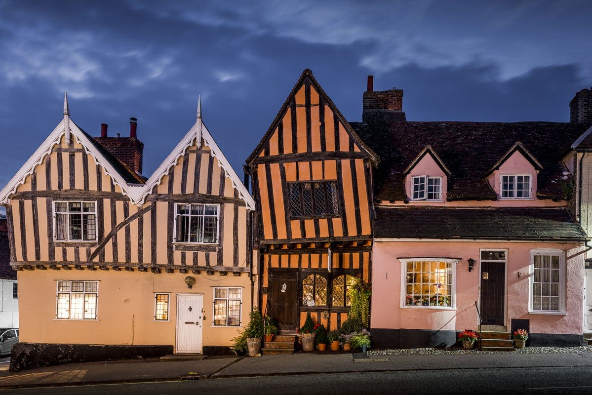 <p>The Crooked House, Lavenham is a 14th century historic house that is said to be the inspiration for the famous nursery rhyme, ‘There was a Crooked Man’. It is located in the heart of Lavenham, Britain’s best-preserved medieval village. The house has a distinctive tilted appearance due to its timber frame and uneven foundations.</p><p><br></p><p>The Crooked House is currently home to the Crooked Men, Alex and Oli, who bought the house in 2021 and have been lovingly restoring and reimagining it ever since4. They host various experiences and events, such as black tie dinners, immersive tours, private hire, gifts and art. They also share their story and the history of the house on their website and social media.</p><p><br></p><p>The Crooked House is one of the world’s most photographed homes and a popular tourist attraction in Lavenham. It is also a part of the Historic Houses association, which represents over 1,600 independently owned historic houses, castles and gardens across the UK.</p>