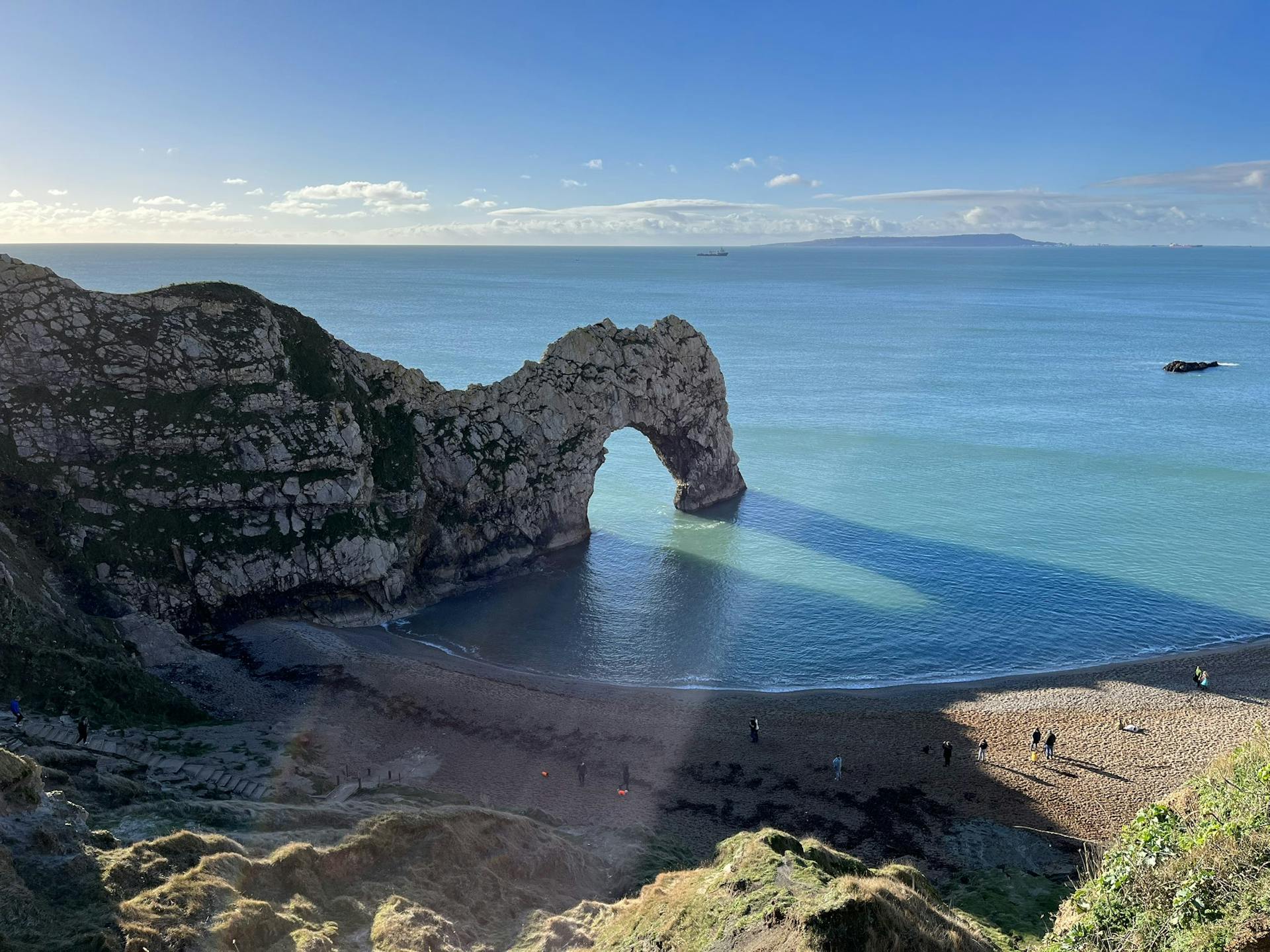 <p>The Jurassic Coast is a World Heritage Site on the English Channel coast of southern England. It stretches from Exmouth in East Devon to Studland Bay in Dorset, a distance of about 96 miles (154 km), and was inscribed on the World Heritage List in mid-December 2001.</p><p><br></p><p><u>Some of the features and highlights of the Jurassic Coast are</u></p><p><br></p><p>It showcases 185 million years of geological history, covering the Triassic, Jurassic and Cretaceous periods, and revealing how the Earth and its life forms have changed over time.</p><p><br></p><p>It is famous for its fossils, which include marine reptiles, ammonites, dinosaurs, plants and insects. Some of the most notable fossil collectors and palaeontologists, such as Mary Anning, William Buckland and Richard Owen, made important discoveries here.</p><p><br></p><p>It has diverse and spectacular landscapes, such as arches, stacks, coves, lagoons, cliffs, beaches and islands. Some of the most iconic landmarks are Durdle Door, Lulworth Cove, Chesil Beach, Portland Bill, Golden Cap and Old Harry Rocks.</p><p><br></p><p>It offers a range of outdoor activities and wildlife experiences, such as walking, cycling, kayaking, sailing, fishing, birdwatching, rock pooling and stargazing. It is home to many rare and protected species, such as the Adonis blue butterfly, the sand lizard, the little tern and the peregrine falcon.</p><p><br></p><p>It has a rich cultural and historical heritage, with many attractions, events and festivals that celebrate its natural and human stories. Some of the places to visit are Lyme Regis Museum, Charmouth Heritage Coast Centre, Durlston Country Park, Lulworth Castle and Corfe Castle.</p><p><br></p>