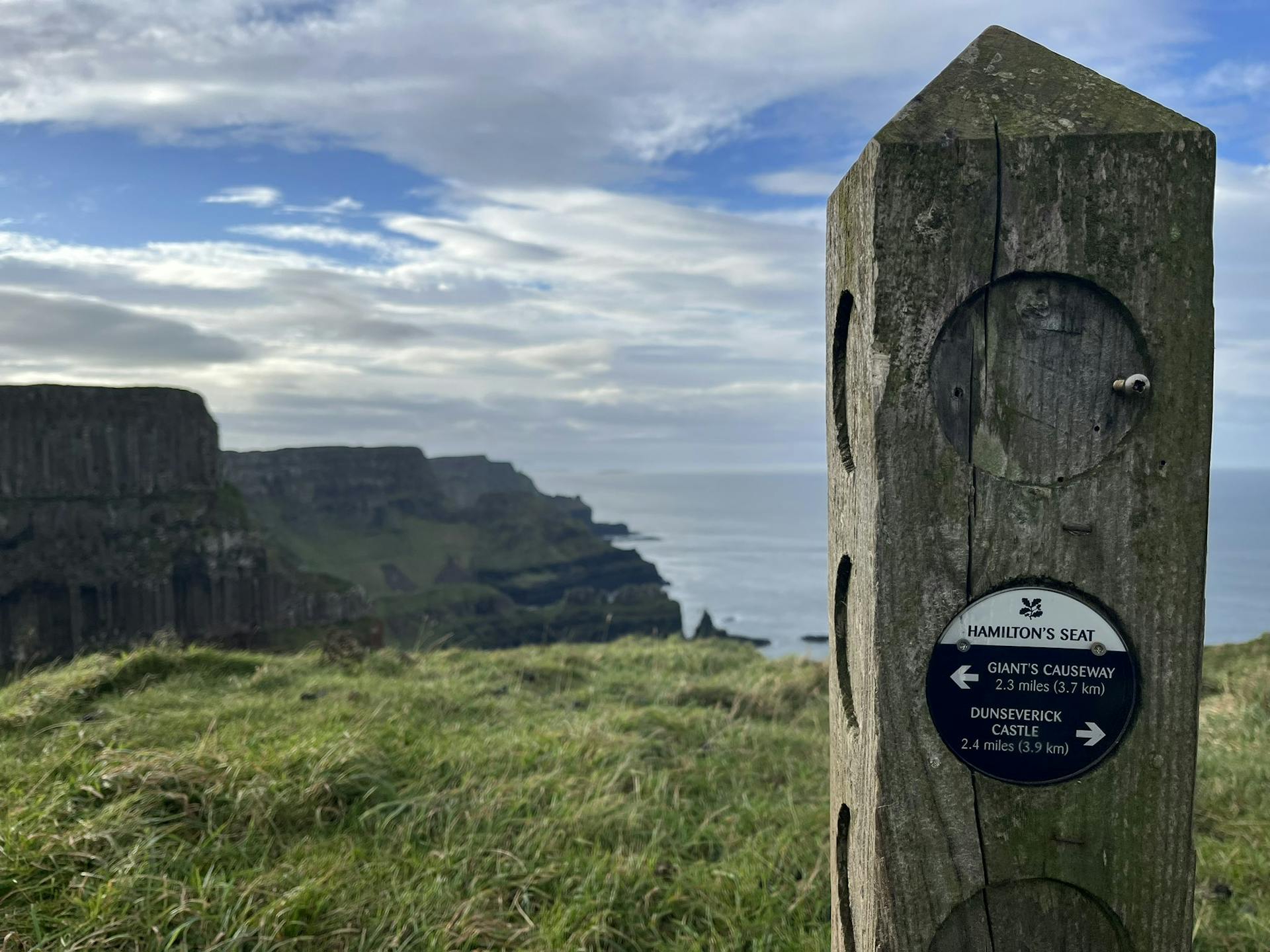 <p>Hamilton’s Seat is a viewpoint on the upper cliff path of the Giant’s Causeway, where you can see the spectacular coastline and the basalt columns from a different perspective. It is named after William Hamilton, a geologist who studied the causeway in the 18th century. </p><p><br></p><p>Hamilton’s Seat is located near Port na Tober, a small bay with a natural arch and a waterfall. It is one of the highlights of the red trail, which is a 4.5 km circular walk that follows the entire causeway coastline. </p><p><br></p><p>You can reach Hamilton’s Seat by walking from the visitor centre or taking the minibus to the causeway and then following the signs for the red trail. Hamilton’s Seat is a great place to enjoy the scenery and learn more about the geology and history of the Giant’s Causeway.</p>