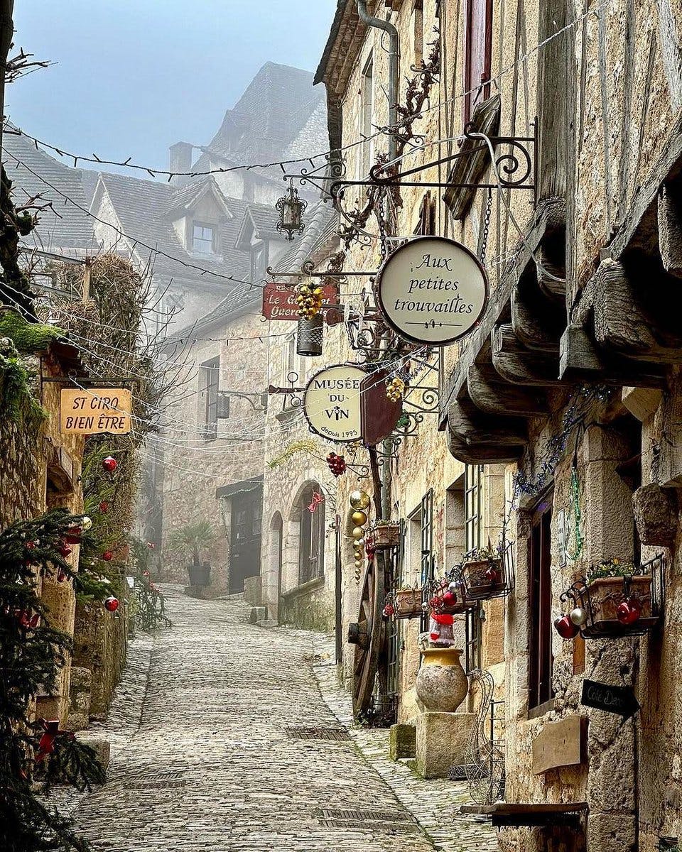 <p>Saint-Cirq-Lapopie is a commune in the Lot department in south-western France. It is a member of the Les Plus Beaux Villages de France (The most beautiful villages in France) association.</p><p><br></p><p>The village is situated on a steep cliff 100 meters above the Lot River, and has a rich history dating back to the 13th century. It was the main seat of one of the four viscounties that made up Quercy, a former province of France. The village was divided among four feudal dynasties: the Lapopie, Gourdon, Cardaillac and Castelnau families.</p><p><br></p><p>Saint-Cirq-Lapopie has attracted many artists and writers over the years, such as the Post-Impressionist painter Henri Martin, the Surrealist poet André Breton, and the Lithuanian-born communist activist Charles Rappoport. Breton, who founded the Surrealist movement, said, “I no longer want to be anywhere else,” when he spoke of Saint-Cirq-Lapopie.</p><p><br></p><p>The village contains many beautiful stone buildings with brown-tiled roofs that date back to the 13th to 16th centuries. Some of the notable landmarks include the Gothic church of Saint-Cirq, the fortified gates of the village, the Maison de la Fourdonne (the oldest house in the village), and the Maison Daura (the former residence of the artist Pierre Daura).</p><p><br></p><p>Saint-Cirq-Lapopie is also a popular destination for nature lovers and outdoor enthusiasts. The village overlooks the unspoiled views of the Vallée du Lot (the Lot Valley), where visitors can enjoy hiking, biking, canoeing, fishing, and cruising along the river. One of the attractions along the river is the towpath, which was carved by hand in the mid 1800s and decorated with intricate seashells, sand dollars and other designs by a local artist.</p><p><br></p><p>Saint-Cirq-Lapopie was voted France’s favorite village in 2012, and it’s not hard to understand why. It is a place of stunning beauty, historical charm, and artistic inspiration.</p>