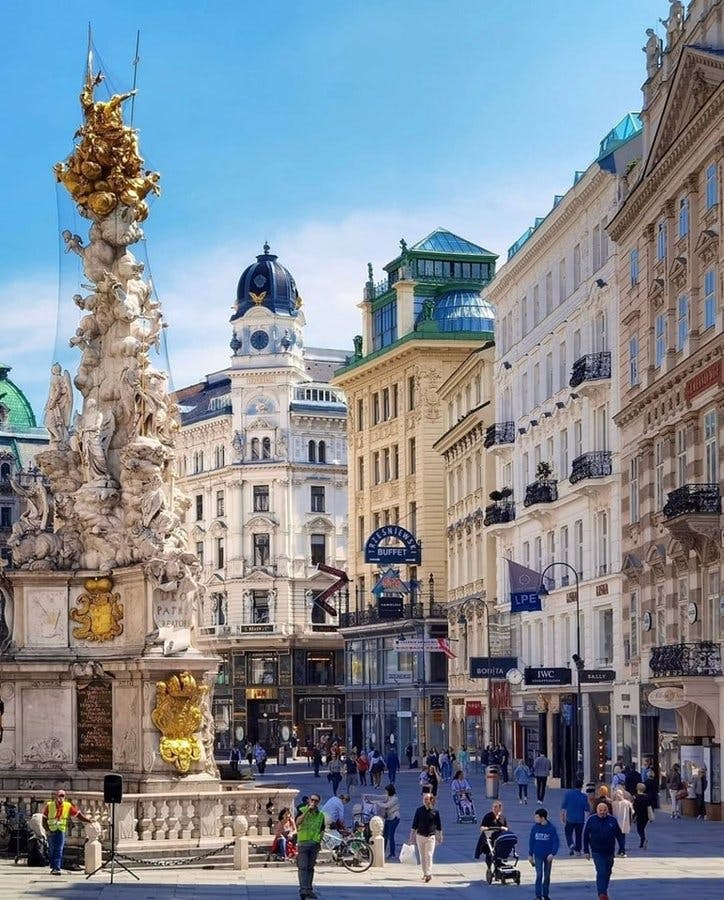 <p>Graben Street is one of the most famous and historic streets in Vienna, the capital of Austria. It is located in the first district, the city center, and it is a pedestrian zone with many shops, cafes, and monuments. Here are some interesting facts about Graben Street:</p><p><br></p><p>The name “Graben” means “ditch” in German, and it refers to the old Roman trench that used to run along the street. The trench was part of the fortification of the ancient settlement of Vindobona, which later became Vienna. The trench was filled and leveled in the 12th century, when the city was expanded by the Babenberg Dukes.</p><p><br></p><p>Graben Street was the main artery of the city in the Middle Ages, and it was lined with wooden houses. However, a fire in 1327 destroyed most of the area, and the street was rebuilt with stone buildings in the following centuries. Many of the current buildings date from the 17th and 18th centuries, and they represent different architectural styles, such as Baroque, Rococo, and Neo-Classicism.</p><p><br></p><p>Graben Street is famous for its plague column, also known as the Trinity Column or the Pestsäule. It is a Baroque monument that was erected in 1693 to commemorate the end of the plague epidemic that killed more than a third of the city’s population in 1679. The column is decorated with statues of saints, angels, and allegorical figures, and it symbolizes the gratitude and faith of the Viennese people.</p><p><br></p><p>Graben Street is also known for its fountains, which date back to the 15th century. The two main fountains are the Joseph Fountain and the Leopold Fountain, which are located at the opposite ends of the street. They are named after the emperors Joseph I and Leopold I, who ruled Austria in the 17th and 18th centuries. The fountains were originally used for fire fighting and drinking water, but they are now ornamental features that add to the charm of the street.</p><p><br></p><p>Graben Street is a popular shopping destination, as it offers a variety of stores, from traditional to modern. Some of the oldest and most prestigious shops are Albin Denk, a porcelain dealer, Heldwein, a court jeweler, and Nägele &amp; Strubell, a court perfumery. There are also many cafes and restaurants, where visitors can enjoy the Viennese cuisine and coffee culture. One of the most famous cafes is Julius Meinl, a gourmet supermarket and coffee house that has been operating since 1862.</p><p><br></p><p>Graben Street is a must-see attraction for anyone who visits Vienna, as it showcases the rich history, culture, and elegance of the city.</p>